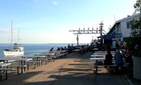 People enjoying a meal at the wharf
