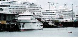 One of the Paspaley-pearl boats with two cruise liners in the background One of the Paspaley-pearl boats with two cruise liners in the background
