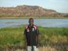 Leslie at the billabong, Gunbalanya, Western Arnhem Land, with the escarpment in the background